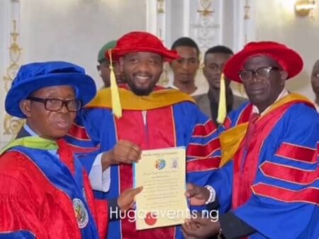 Alhaji Sani CEO ASIA Group while receiving the letter