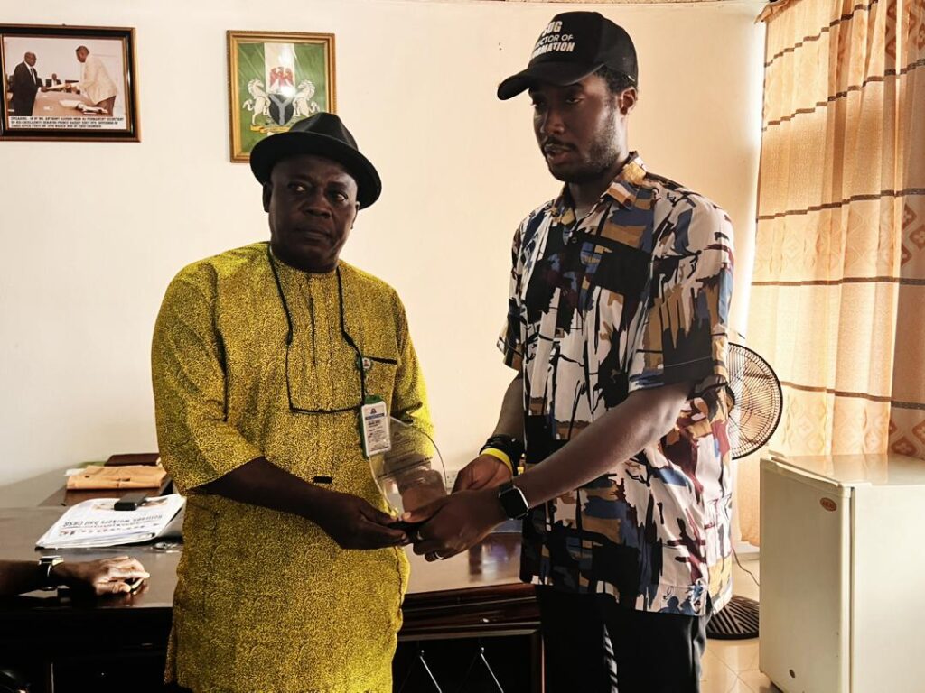 Cross River State Commissioner for Information, Dr. Erasmus Ekpang and Comrade Gift Ogbodum,