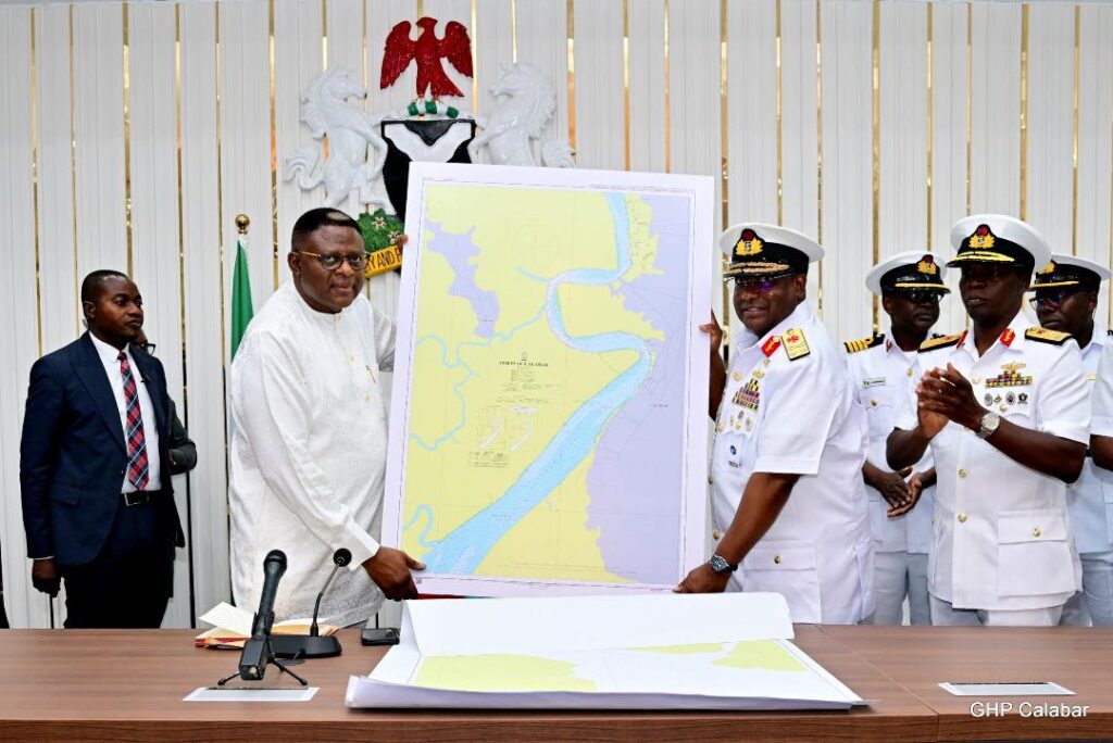 Governor Bassey Otu while receiving the report
