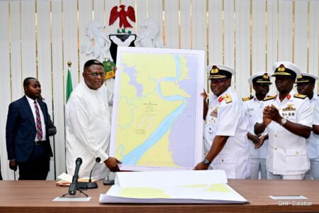 Governor Bassey Otu while receiving the report