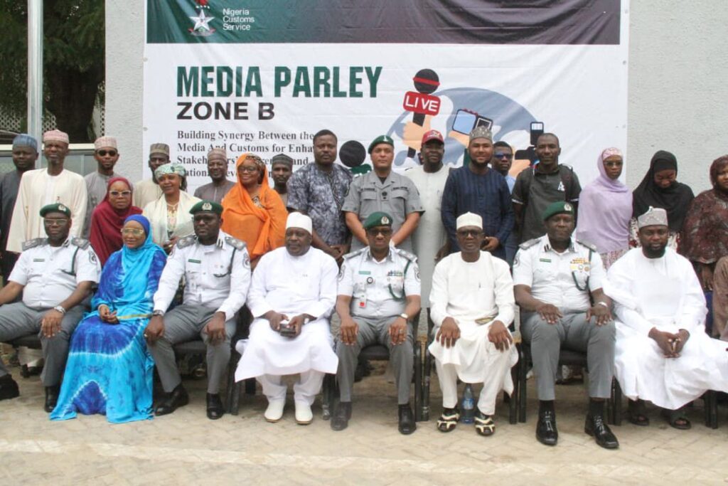 Group photography with custom officers amd and media representatives
